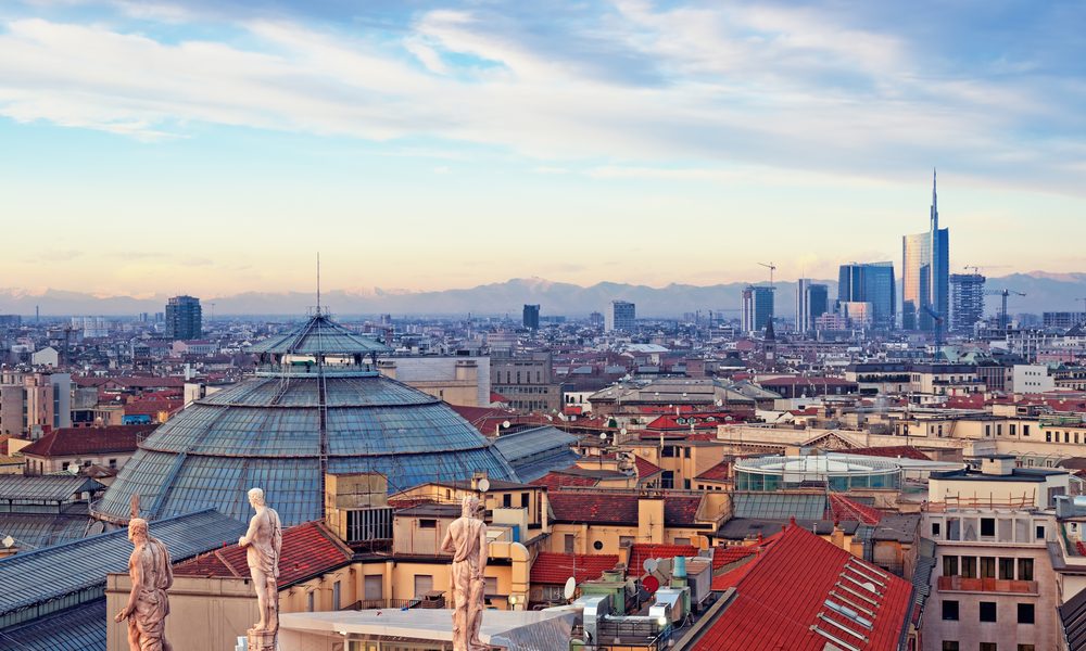 View of Milan from the rooftoop of  “Duomo di Milano”. Statues of  Duomo of Milan, Galleria Vittorio Emanuele II and skycrapert of Porta Nouva als visible.